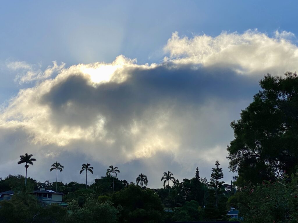 Sun behind a cloud suggesting that Grace is Always Here.