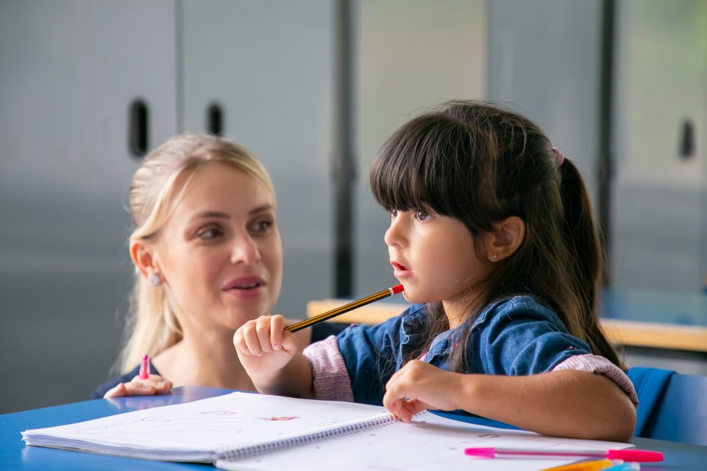 Tutor with Young Child having an AHA moment.